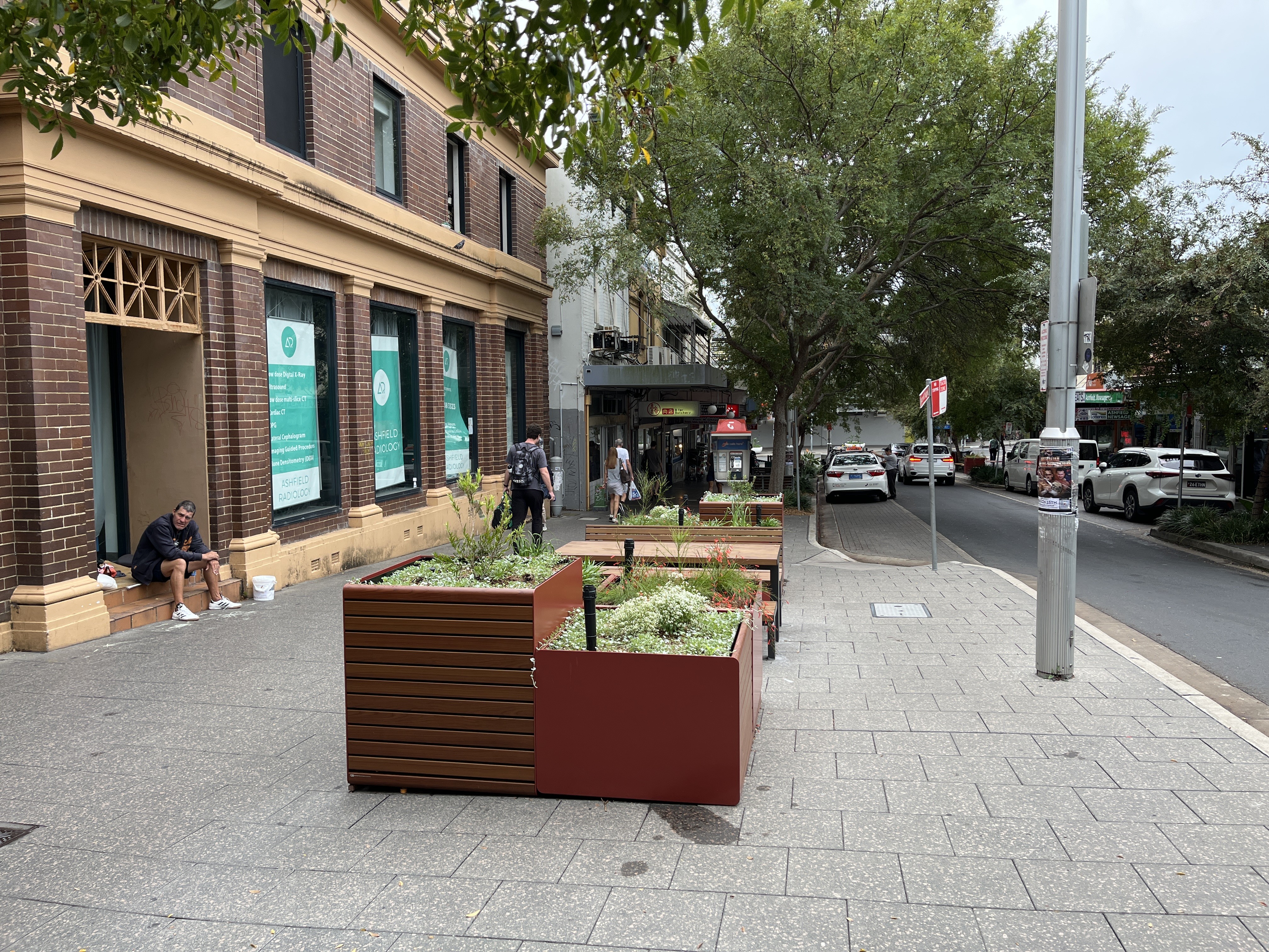 An image of planter box, table and seating