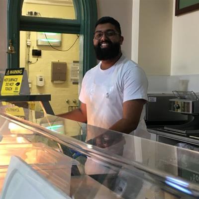 A Sathya Sai Volunteer serving at Exodus\