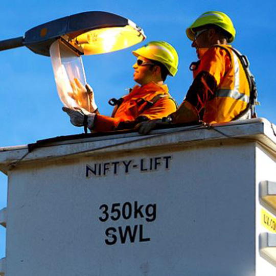 Ausgrid two workmen chaging the street lights 