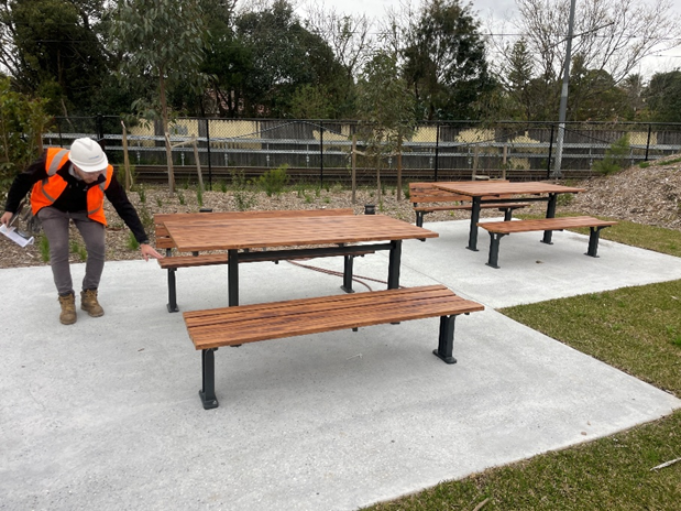 A rest stop with picnic tables and chairs.