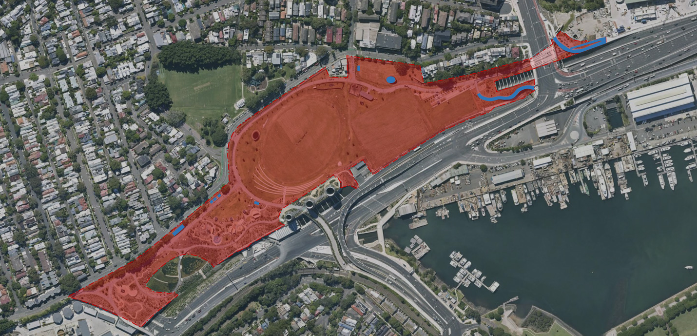 A satellite view of Rozelle Parklands in Sydney, NSW. A shaded area, marked in red, indicates the area under the care and control of Inner West Council. Unmarked areas, or areas marked in blue, are under the care and control of other entities.