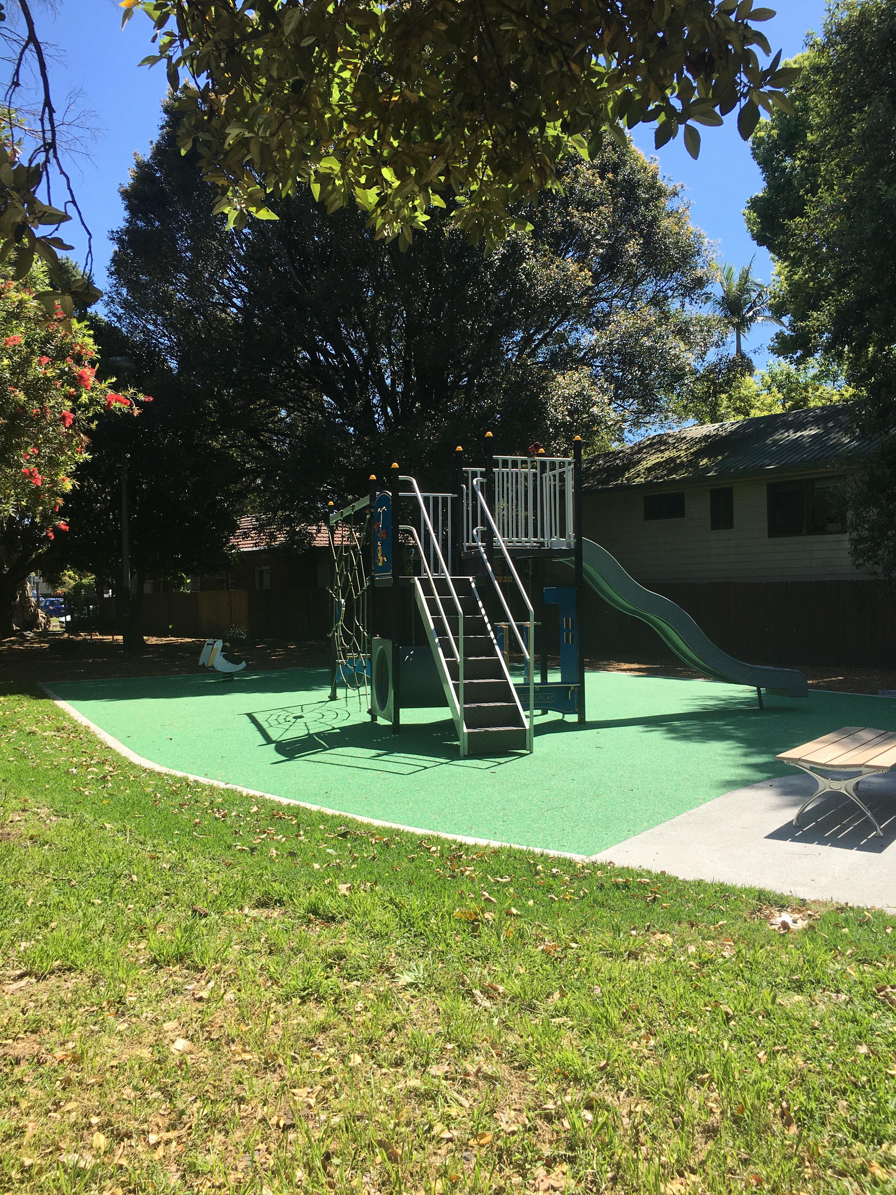 An image of a park showing park equipment